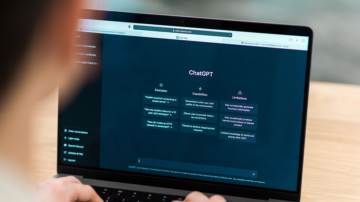 Using ChatGPT Person using ChatGPT on their laptop