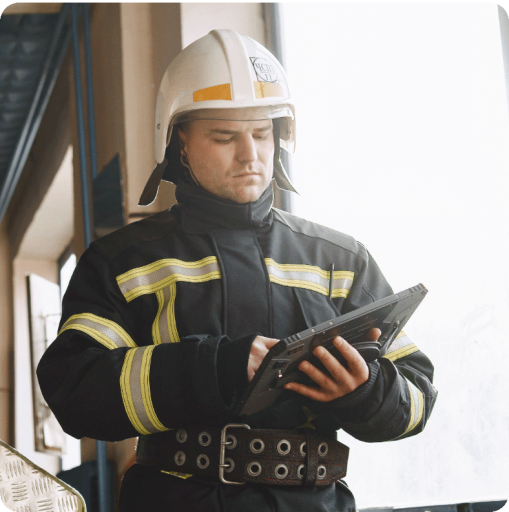 Firefighter holding tablet